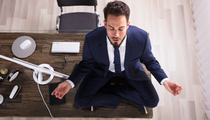 https://vnmanpower.com/images/blog/2025/10/28/original/young-businessman-sitting-desk-yoga_1761623811.jpg
