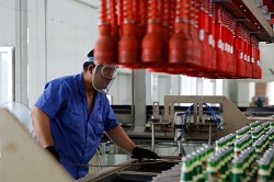 Vietnam beverage industry worker at the production line