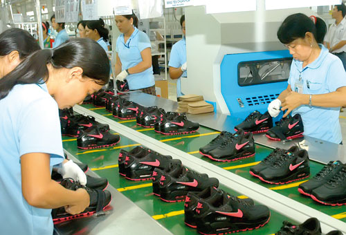 Vietnam footwear worker at the production line